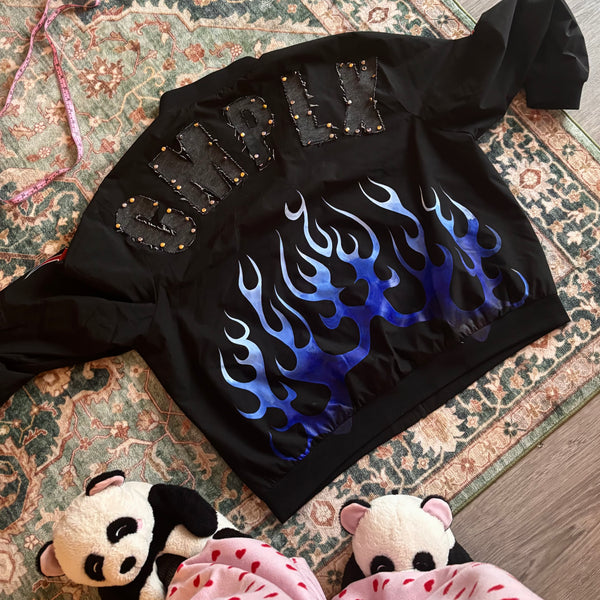 Custom studded denim jacket with flame airbrush design by CMPLX for Manny