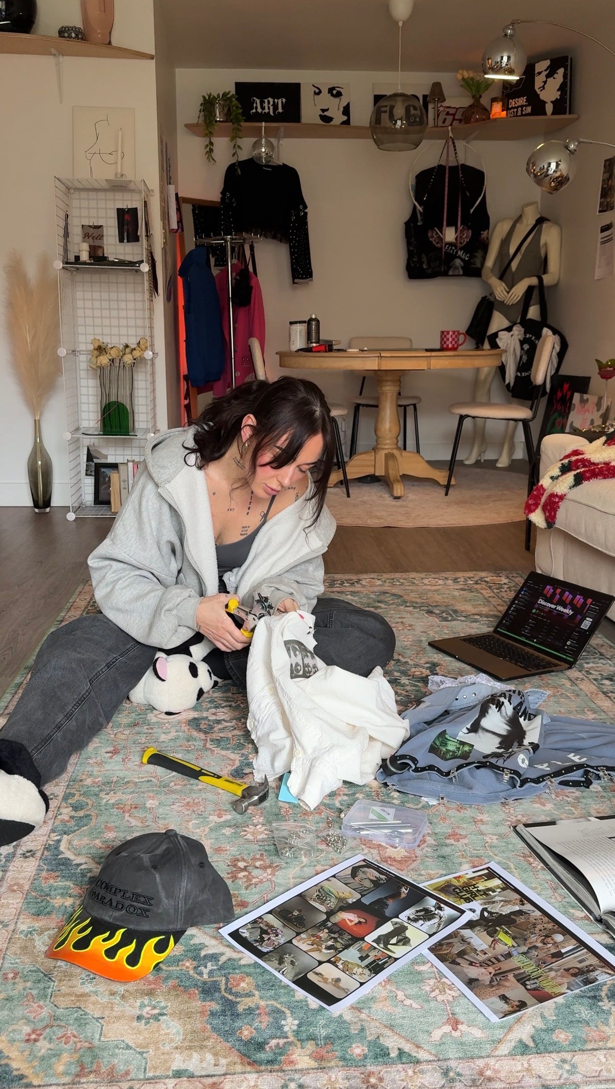 Mcgravz, founder of Complex Paradox (CMPLX), hand-altering a custom clothing piece