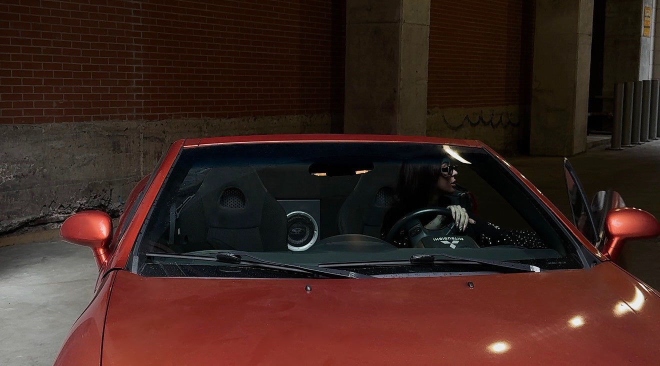 CMPLX Complex Paradox Montreal streetwear brand hero image - model in red car, est. 2023