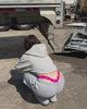 CMPLX hot pink logo thong detail shot styled with grey sweats, Complex Paradox streetwear